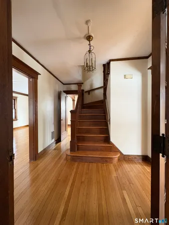 a view of entryway with wooden floor