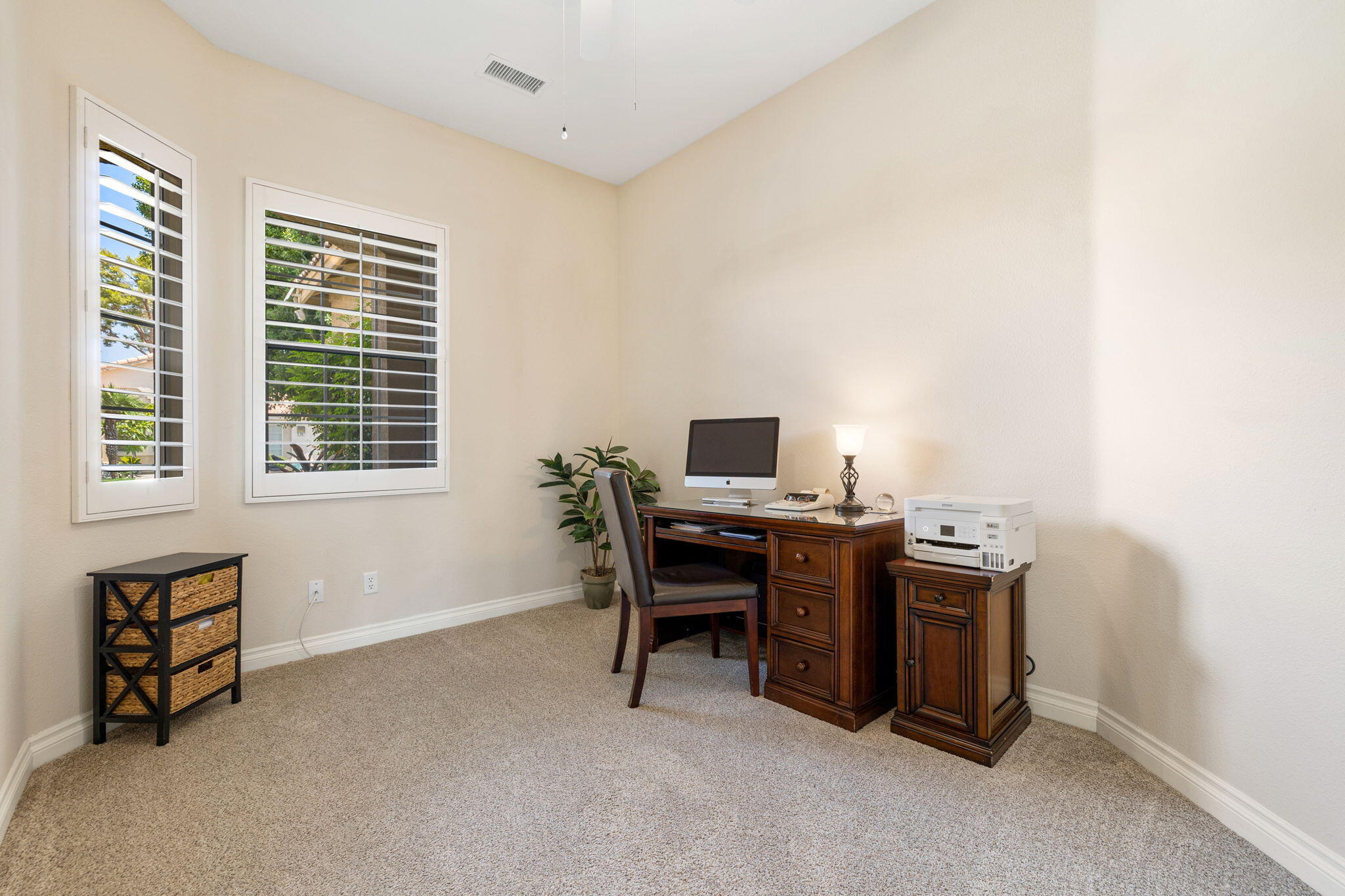 215 Strada Nova Palm Desert, CA 92260 - Photo 26 of 44 a view of a workspace with furniture