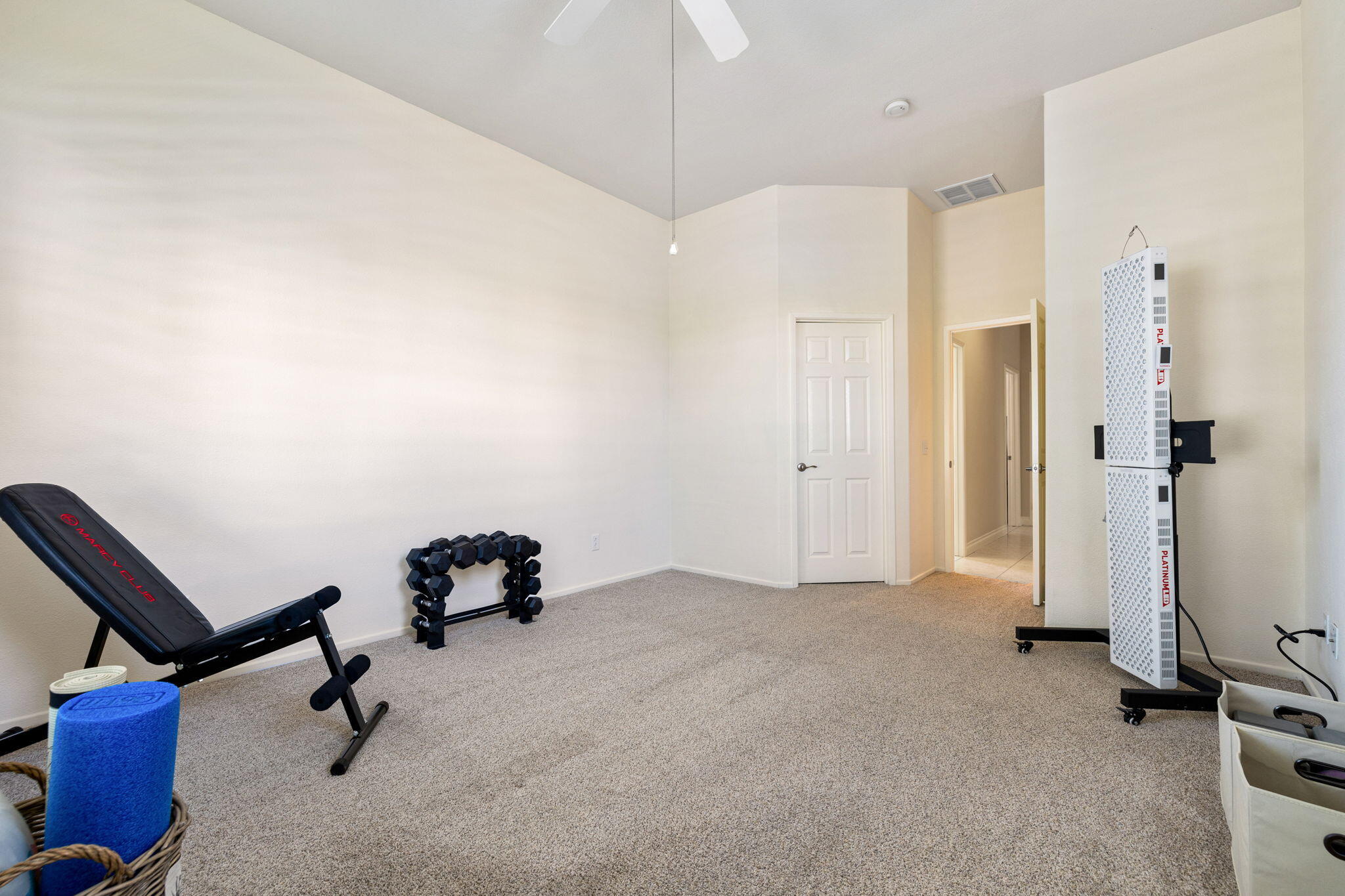 215 Strada Nova Palm Desert, CA 92260 - Photo 28 of 44 a room with gym equipment
