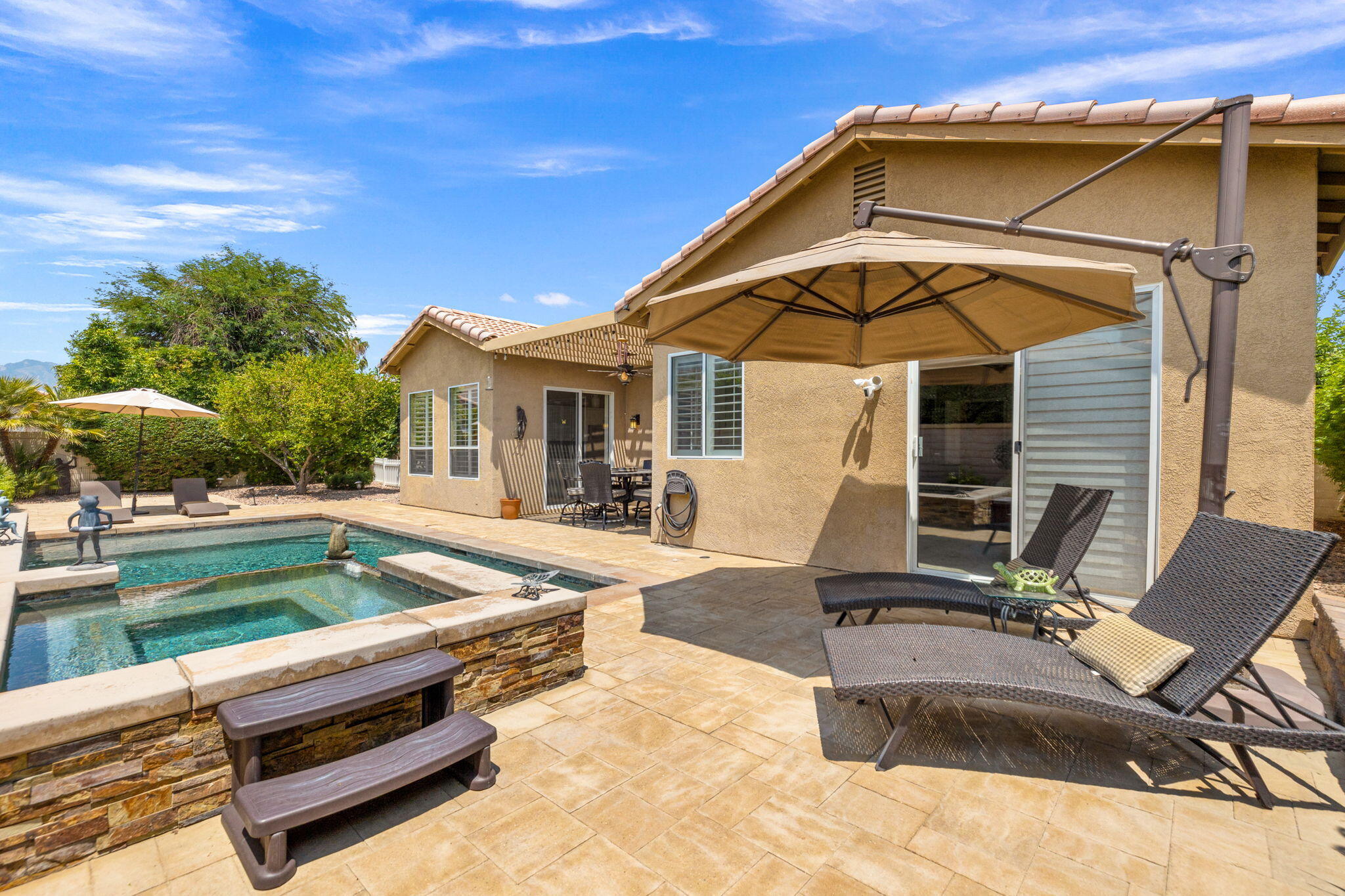 215 Strada Nova Palm Desert, CA 92260 - Photo 38 of 44 a view of house with yard outdoor seating and barbeque oven