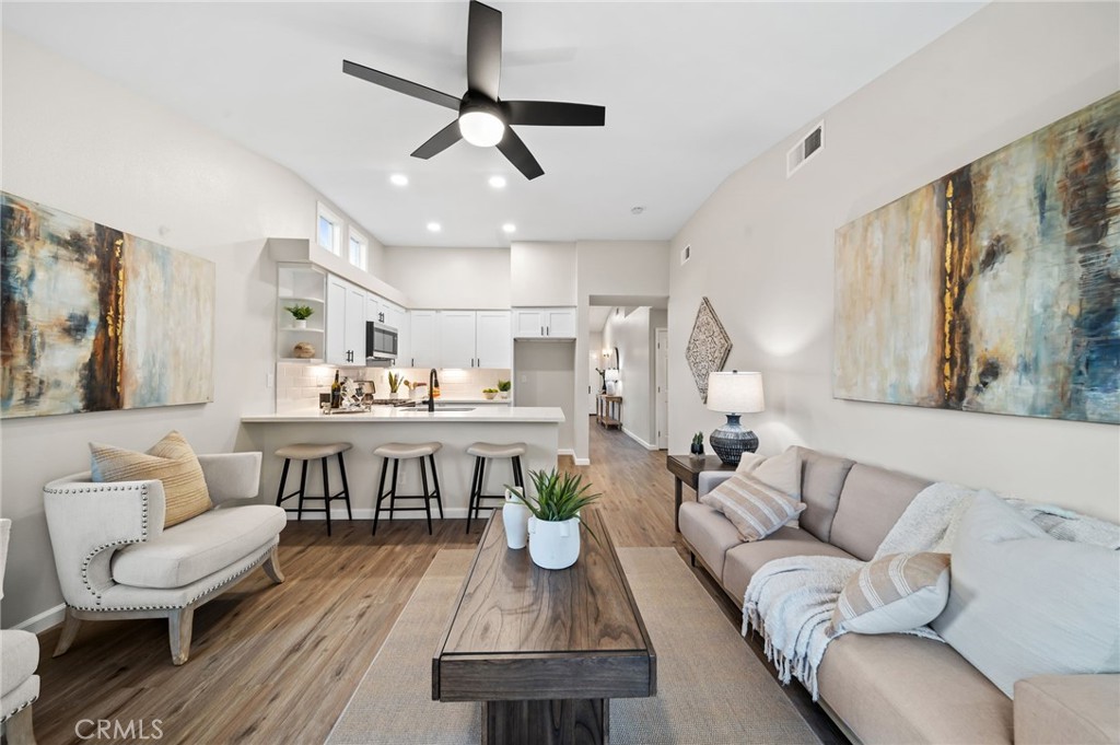 31577 Via Santa Ines Temecula, CA 92592 - Photo 12 of 49 a living room with furniture a rug and white walls