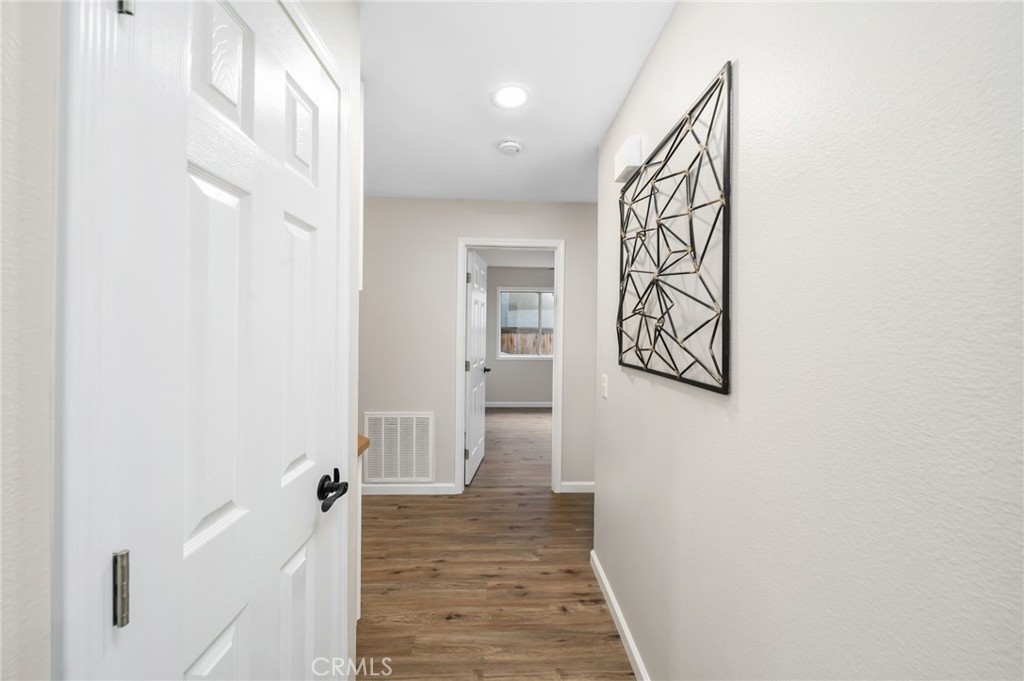 31577 Via Santa Ines Temecula, CA 92592 - Photo 23 of 49 a view of a hallway with wooden floor and entryway