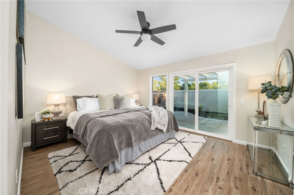 31577 Via Santa Ines Temecula, CA 92592 - Photo 25 of 49 a bedroom with a bed and glass door