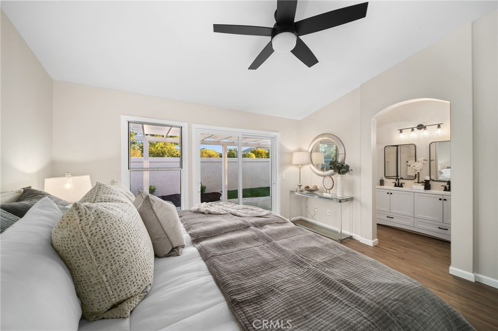 31577 Via Santa Ines Temecula, CA 92592 - Photo 26 of 49 a bedroom with a bed a ceiling fan and a rug
