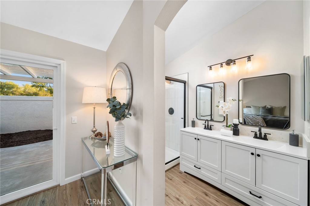 31577 Via Santa Ines Temecula, CA 92592 - Photo 27 of 49 a en suite bathroom with a double vanity sink and a mirror