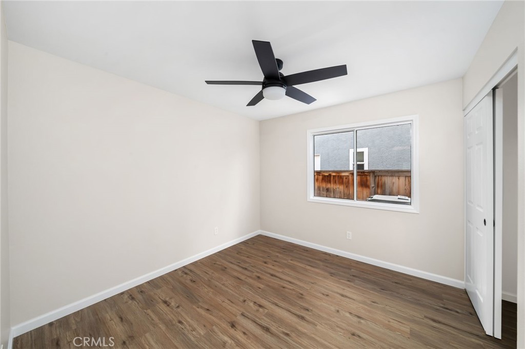 31577 Via Santa Ines Temecula, CA 92592 - Photo 36 of 49 an empty room with wooden floor and windows