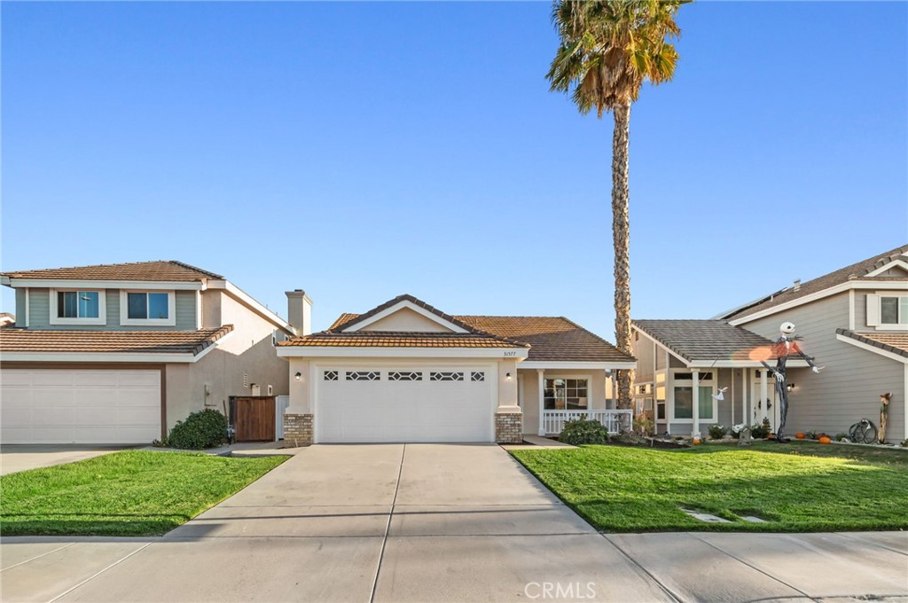 31577 Via Santa Ines Temecula, CA 92592 - Photo 4 of 49 a front view of a house with garden