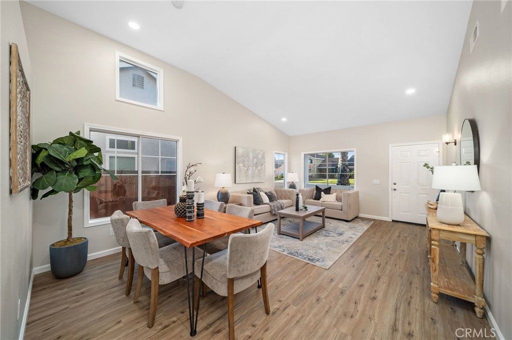 31577 Via Santa Ines Temecula, CA 92592 - Photo 7 of 49 a dining room with furniture and wooden floor