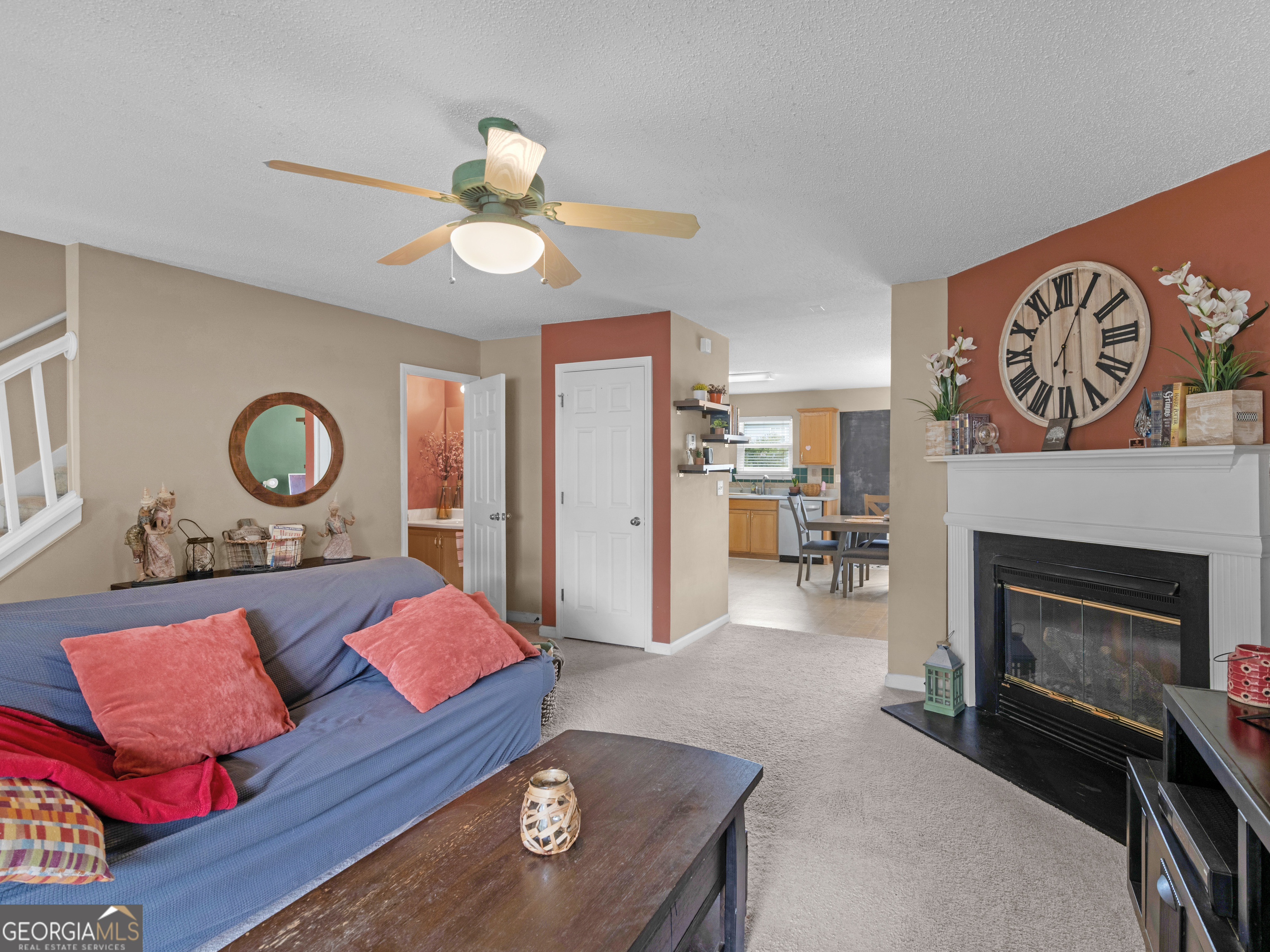 3370 Waggoner Place Rex, GA 30273 - Photo 5 of 25 a living room with furniture and a fireplace
