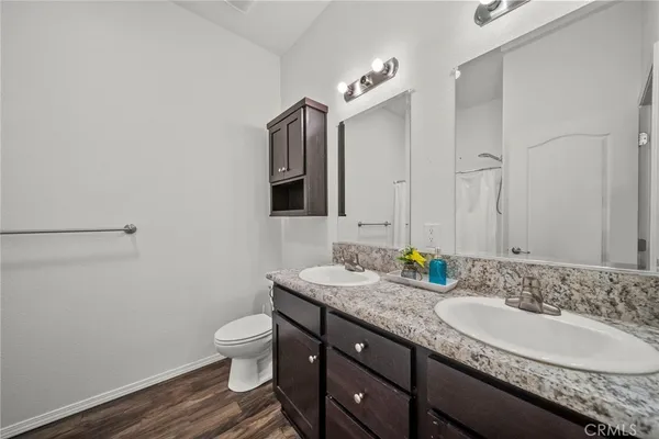 a bedroom with a bed and a cabinets