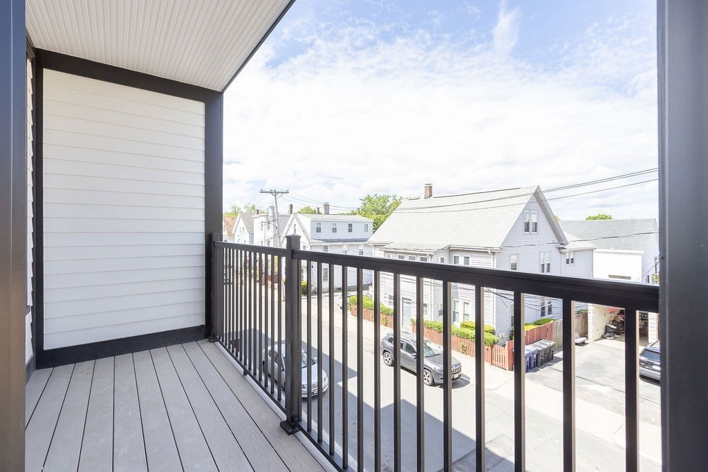 230 Washington Street, Unit 4 Boston, MA 02135 - Photo 12 of 13 a view of a balcony with wooden floor