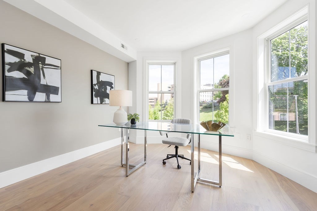 230 Washington Street, Unit 4 Boston, MA 02135 - Photo 10 of 13 a view of a workspace with furniture and a window
