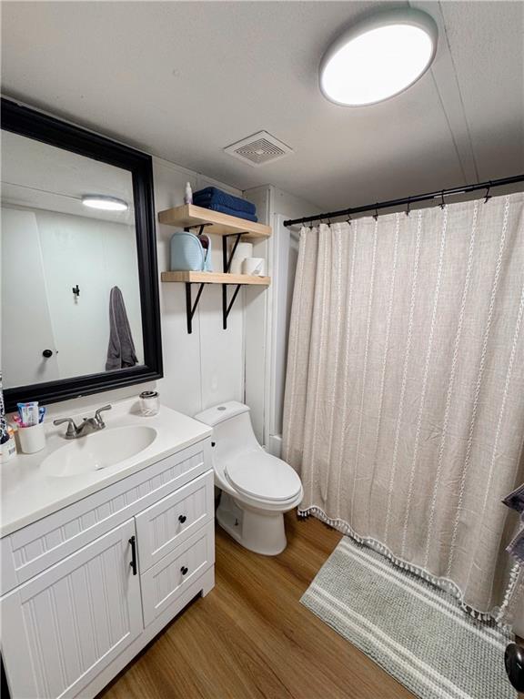 10 Lindsey Lane Northwest Rome, GA 30165 - Photo 12 of 14 a bathroom with a double vanity sink mirror and toilet