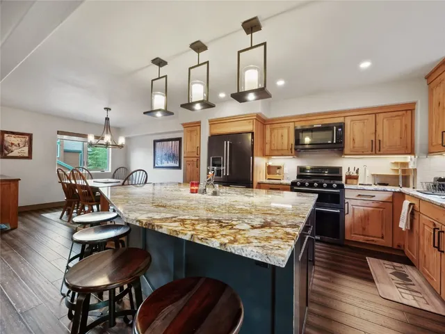 a kitchen with stainless steel appliances granite countertop counter space a sink and cabinets