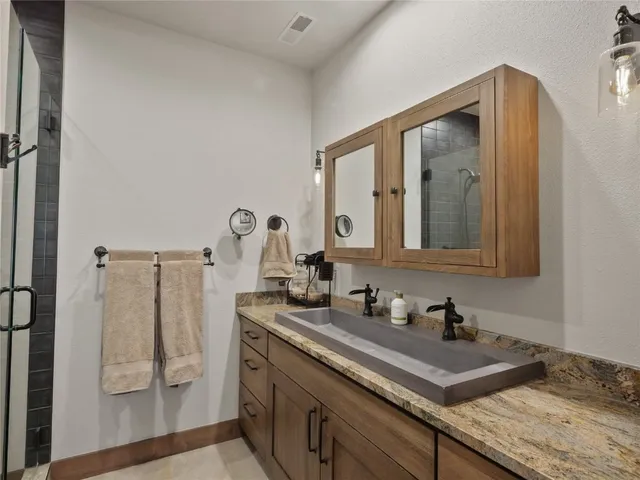 a bathroom with a sink and a mirror