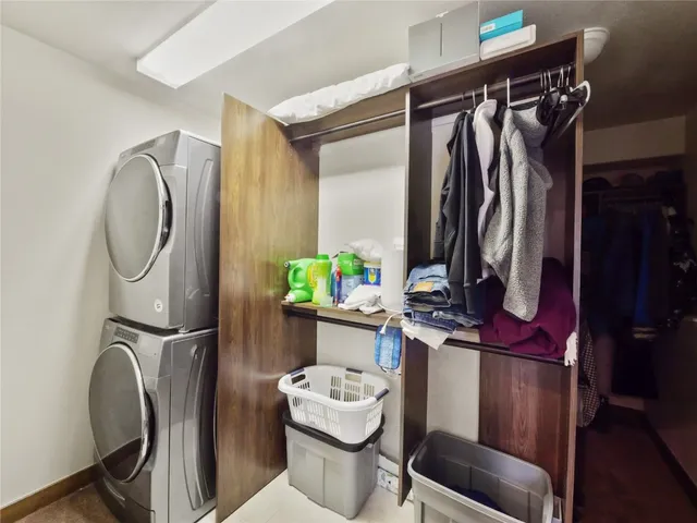 a bathroom with a sink mirror and toilet