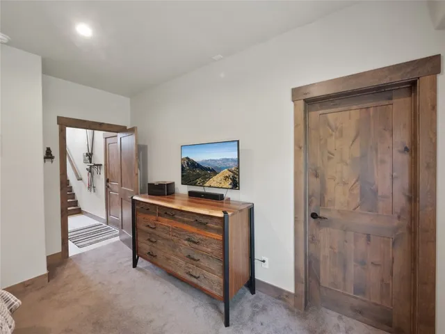 a room with a dresser and a mirror