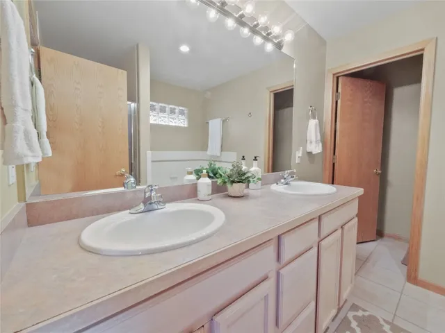 a bathroom with a granite countertop sink a mirror and a