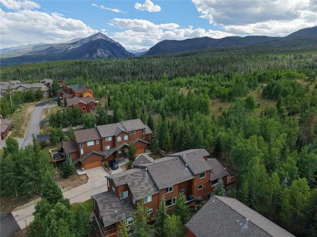 an aerial view of a house with mountain view