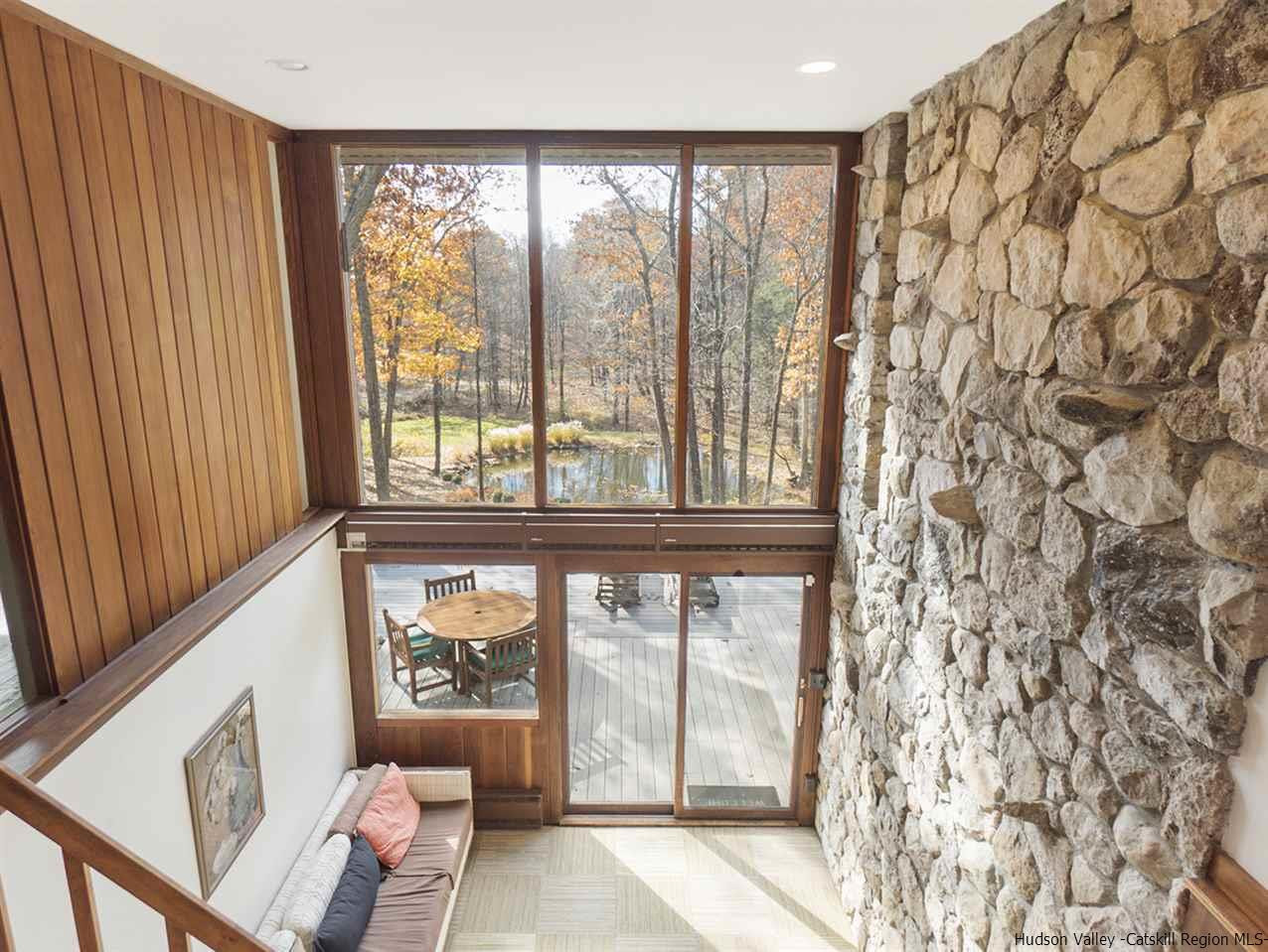 118 Sparkling Ridge Road New Paltz, NY 12561 - Photo 17 of 35 a living room with a large window and furniture
