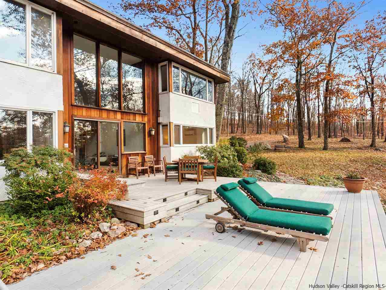 118 Sparkling Ridge Road New Paltz, NY 12561 - Photo 3 of 35 a view of a house with backyard sitting area and garden