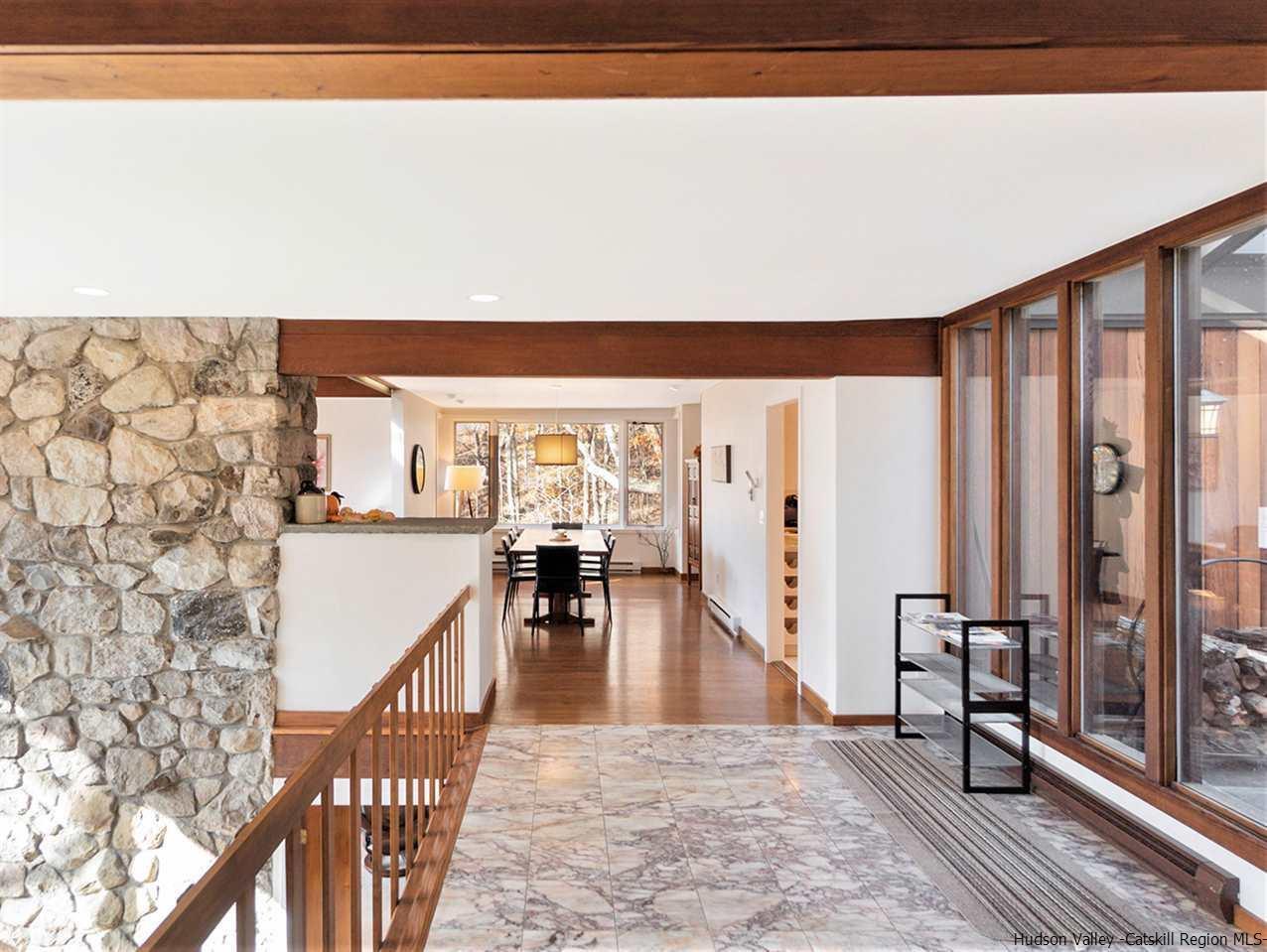 118 Sparkling Ridge Road New Paltz, NY 12561 - Photo 7 of 35 a view of a living room and a balcony