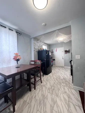 a bedroom with furniture and a wooden floor