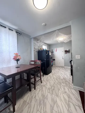 a bedroom with furniture and a wooden floor