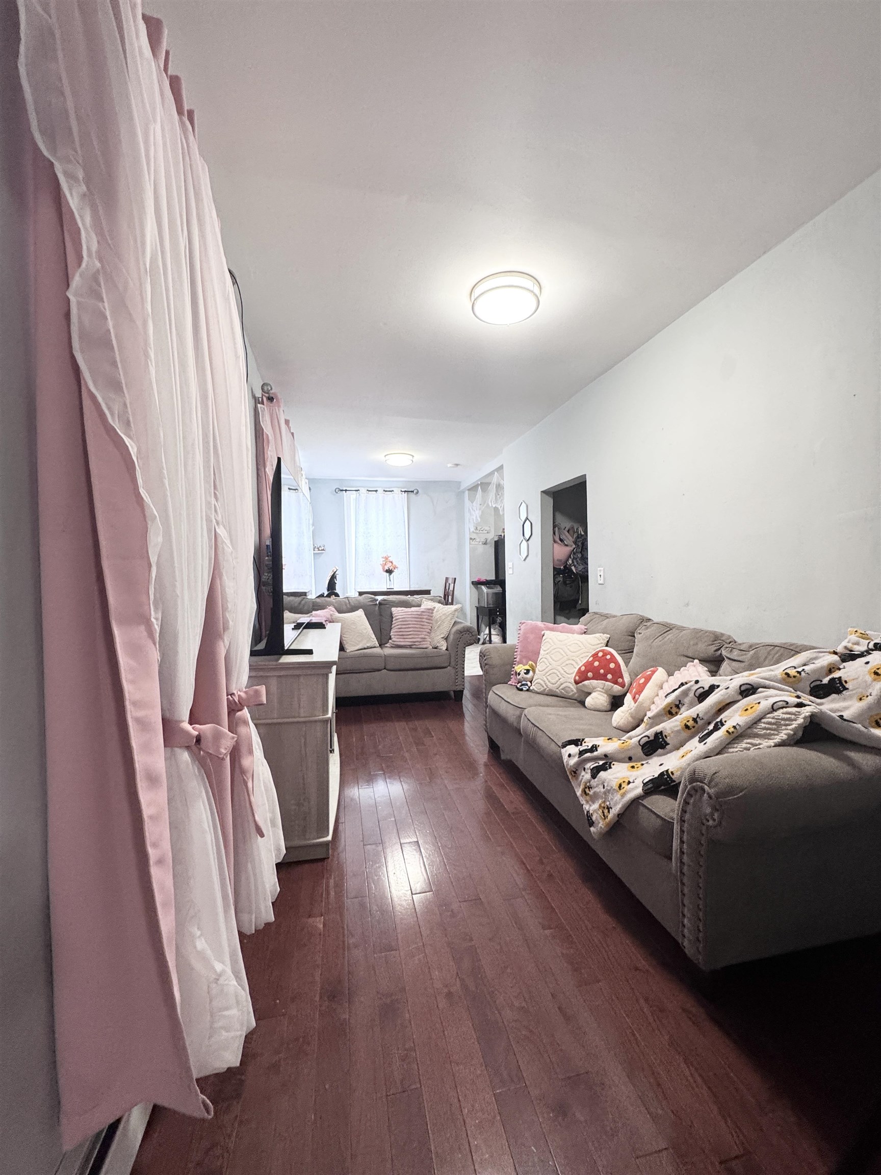 17 Green Court Lodi, NJ 07644 - Photo 5 of 21 a bedroom with furniture and a wooden floor