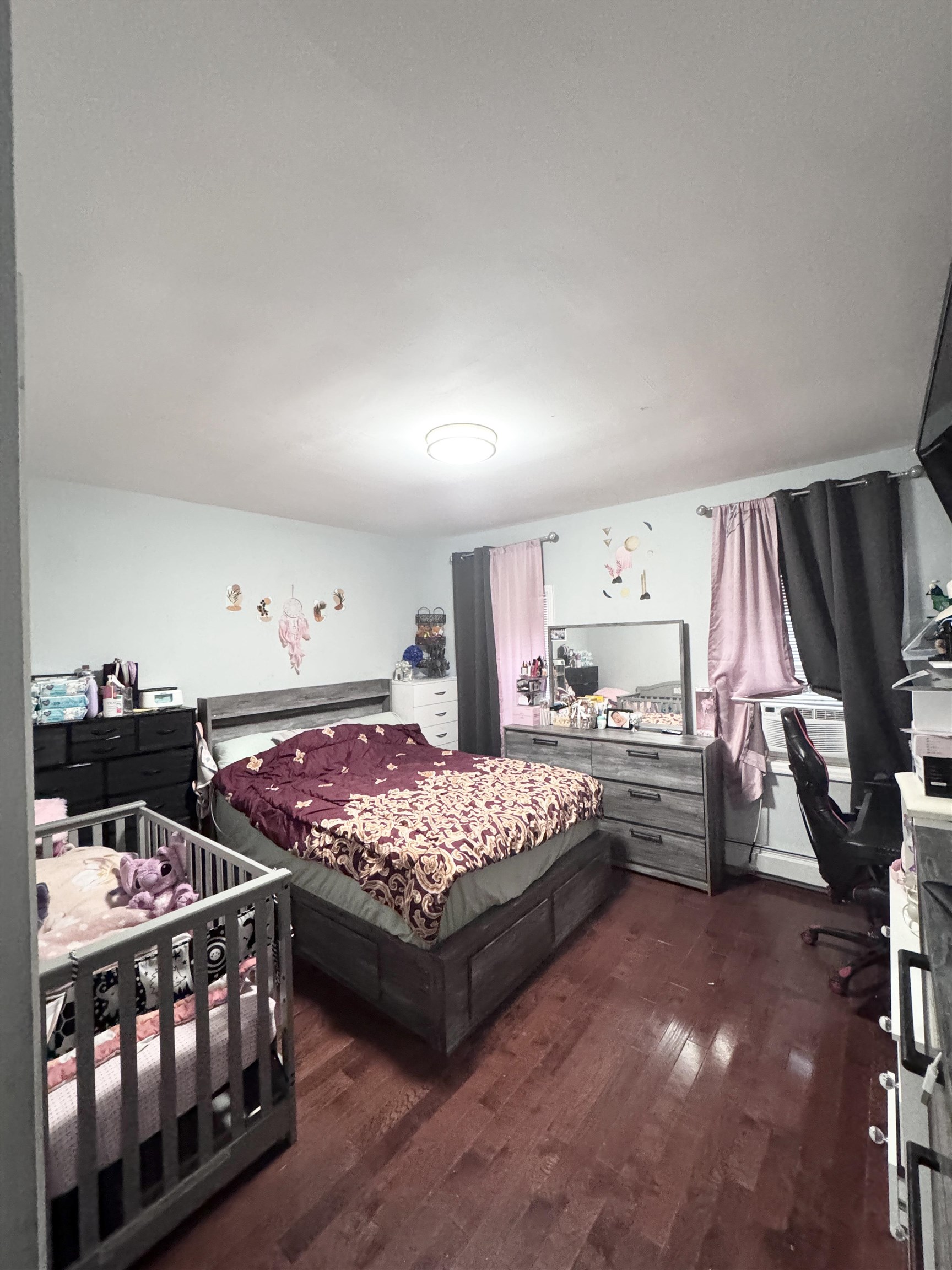 17 Green Court Lodi, NJ 07644 - Photo 6 of 21 a bedroom with bed and a window