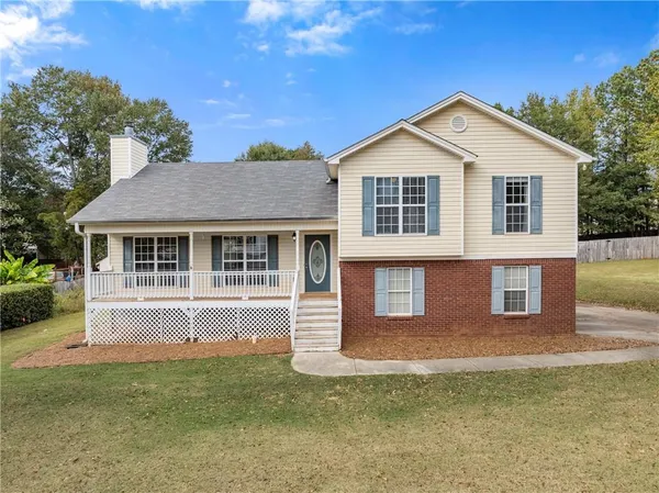 a front view of a house with a yard