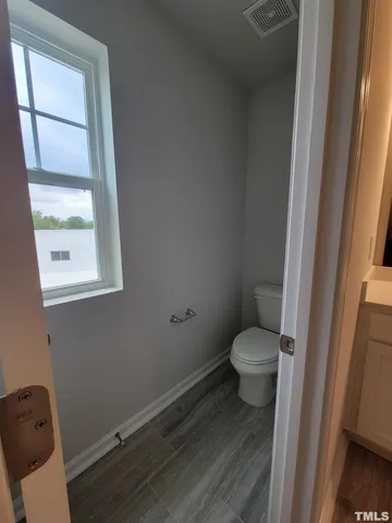 a spacious bathroom with double vanity and a shower