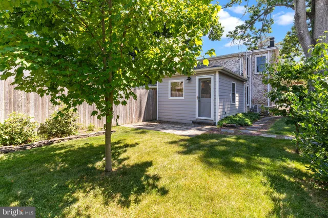 a backyard of a house with yard and tree s