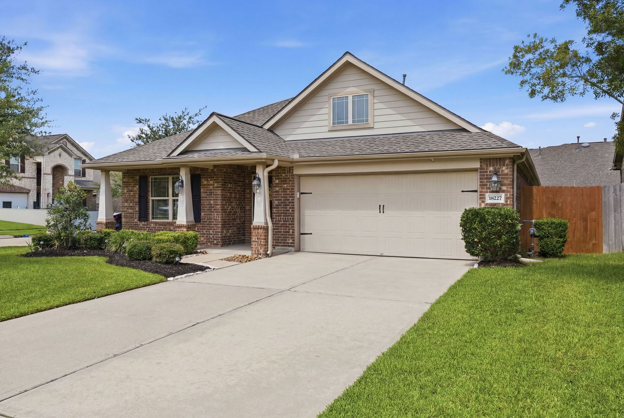 18227 Tacoma Ridge Drive Tomball, TX 77377 - Photo 39 of 45 Welcoming front elevation with a wide driveway and charming covered entry.