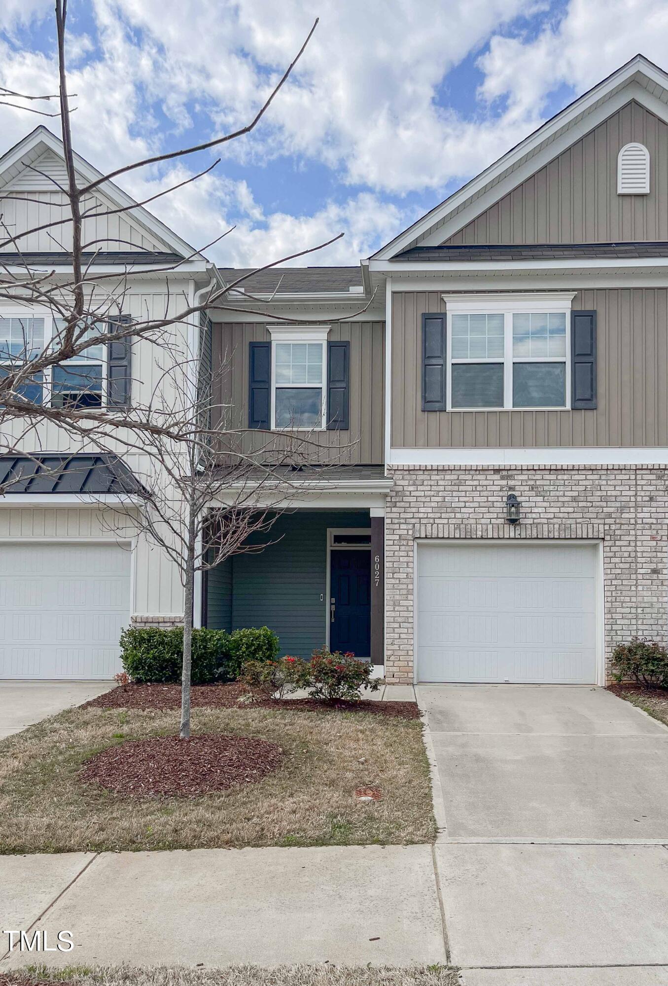 6027 Beale Loop Raleigh, NC 27616 - Photo 1 of 21 a view of a building with many windows