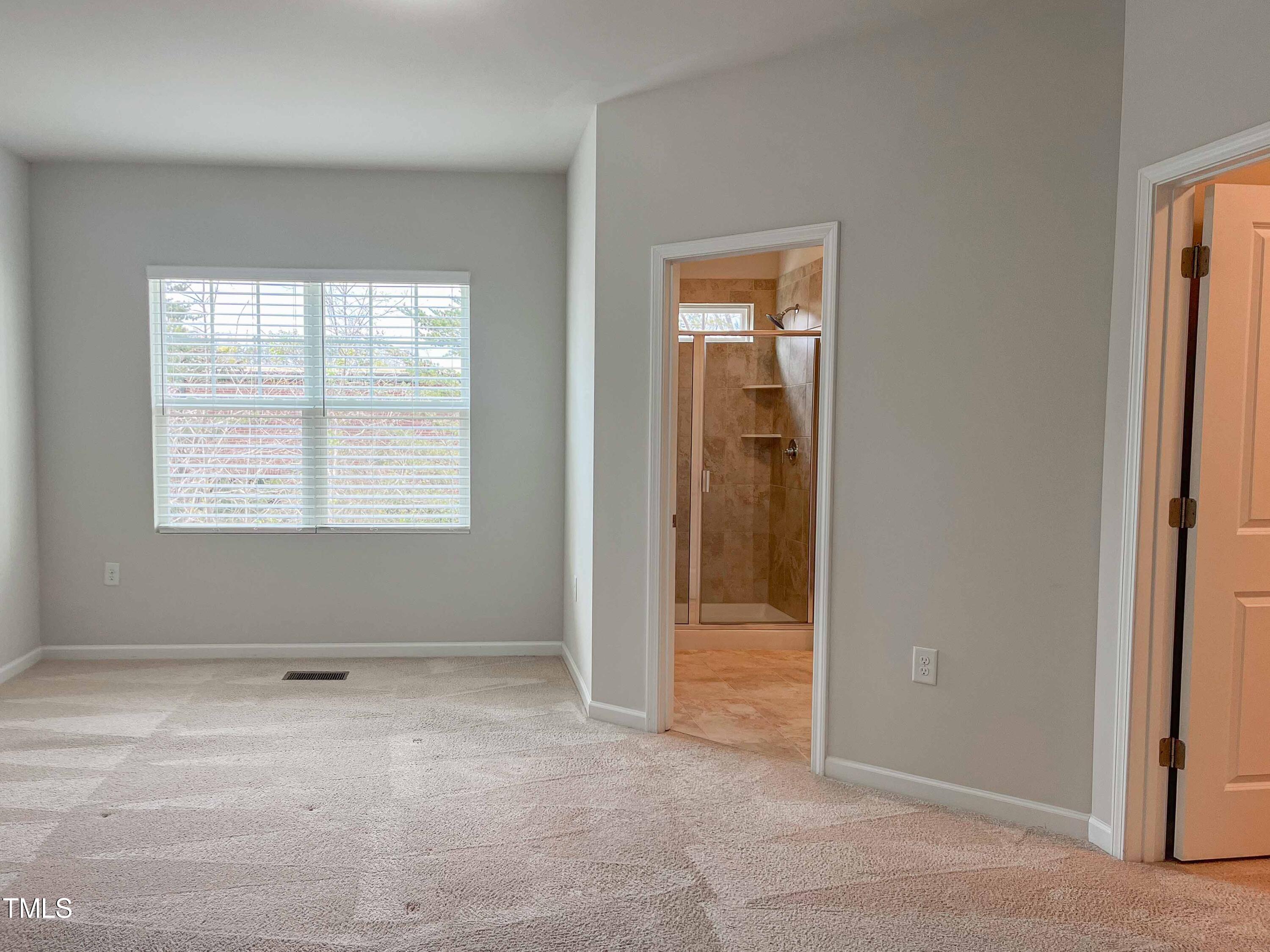 6027 Beale Loop Raleigh, NC 27616 - Photo 11 of 21 an empty room that has a window