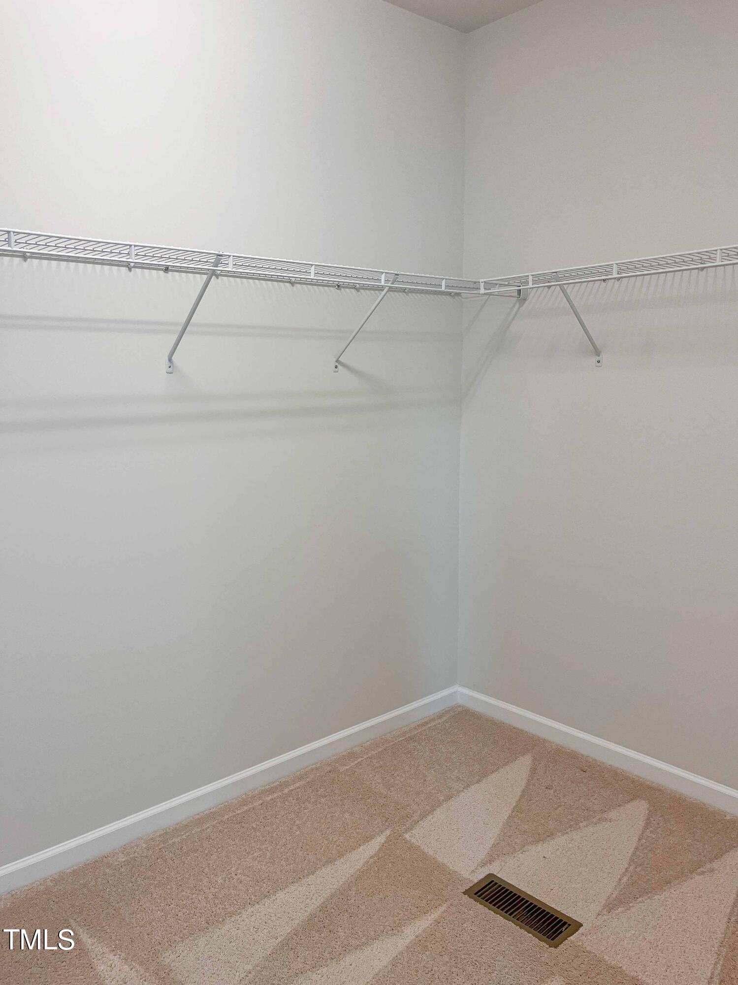 6027 Beale Loop Raleigh, NC 27616 - Photo 14 of 21 a view of a room with racks on the wall