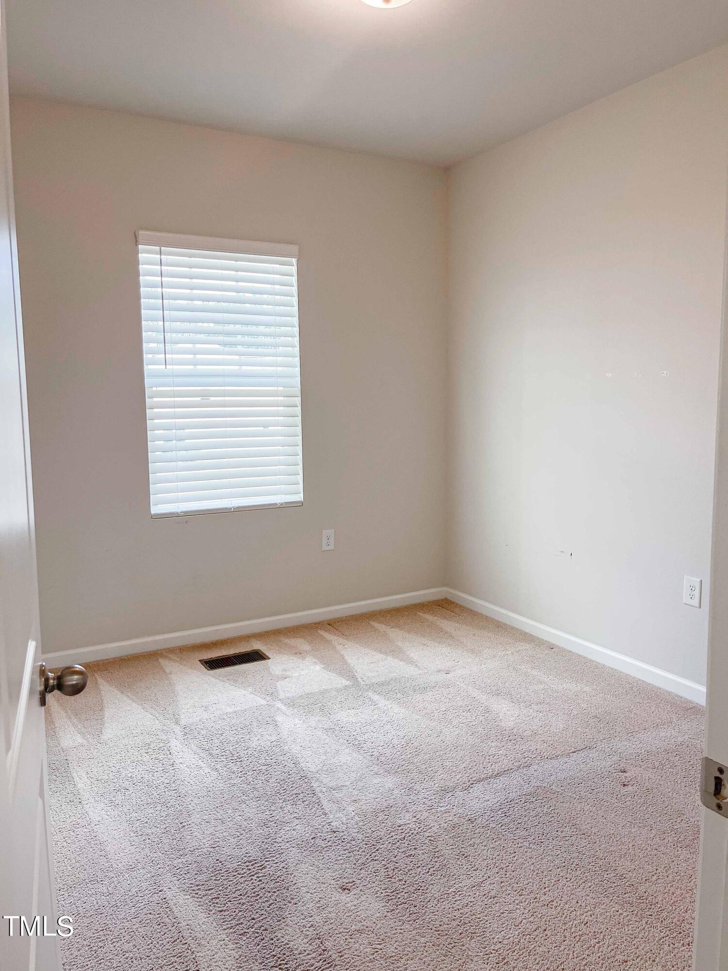 6027 Beale Loop Raleigh, NC 27616 - Photo 16 of 21 an empty room with a empty space and a window