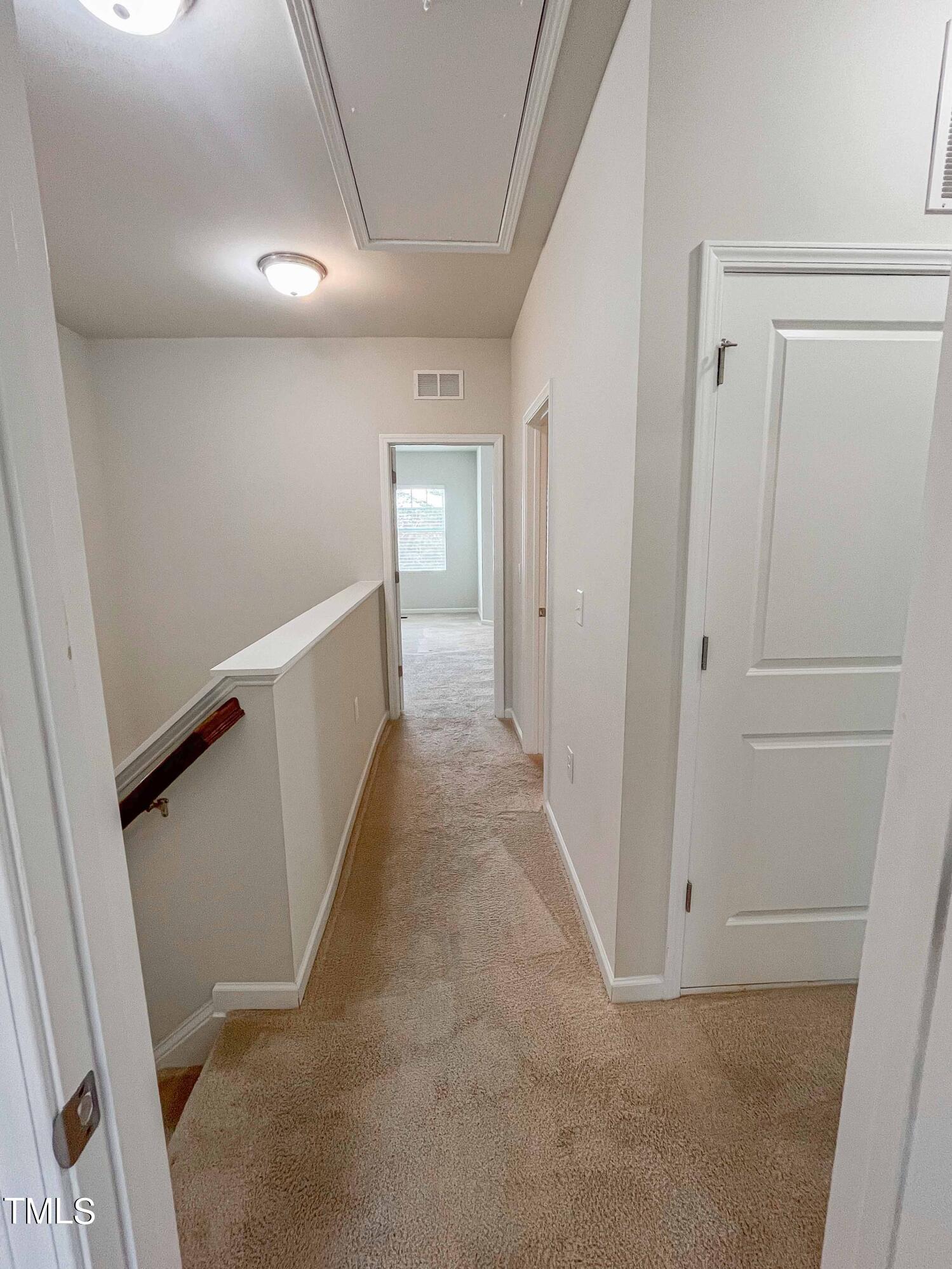6027 Beale Loop Raleigh, NC 27616 - Photo 10 of 21 a view of a hallway with hallway