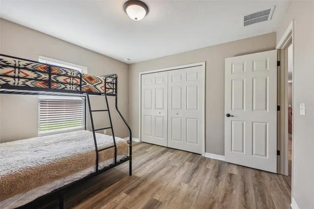a view of an empty room and wooden floor