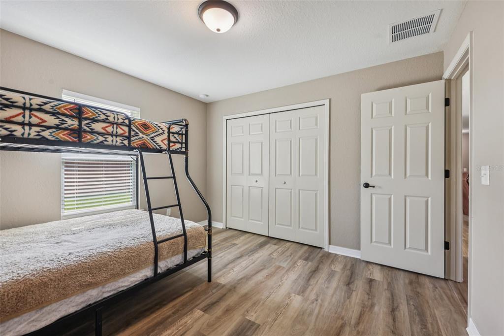 176 Juniper Loop Circle Ocala, FL 34480 - Photo 13 of 21 a view of an empty room and wooden floor