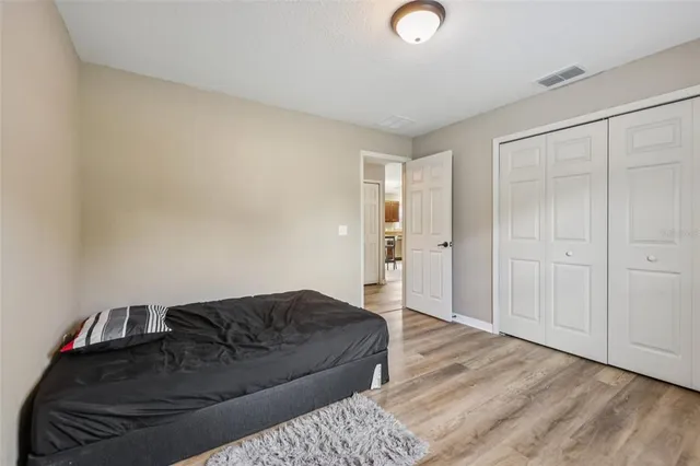 a living room with a bed and furniture