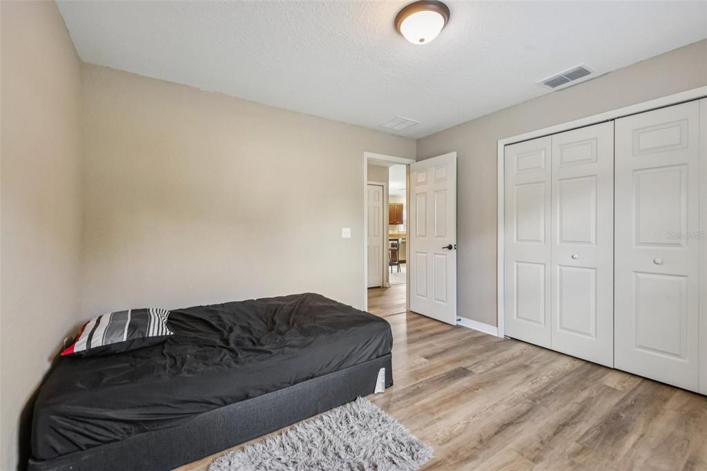 176 Juniper Loop Circle Ocala, FL 34480 - Photo 16 of 21 a living room with a bed and furniture