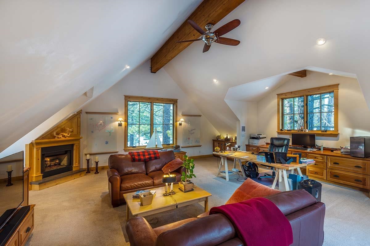 556 Stewart McKay Truckee, CA 96161 - Photo 16 of 21 a living room with furniture a fireplace and a flat screen tv