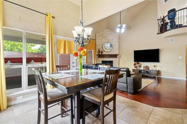 a view of a dining room with furniture wooden floor and chandelier