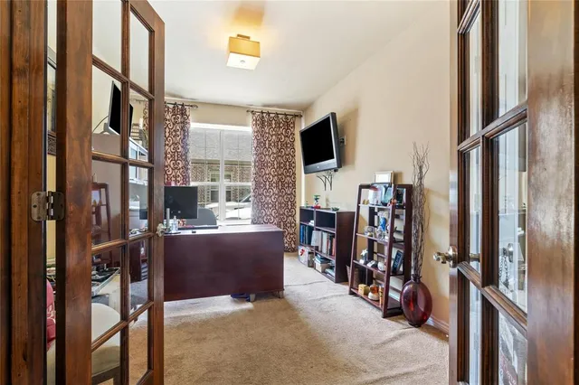 a view of a livingroom with furniture and windows