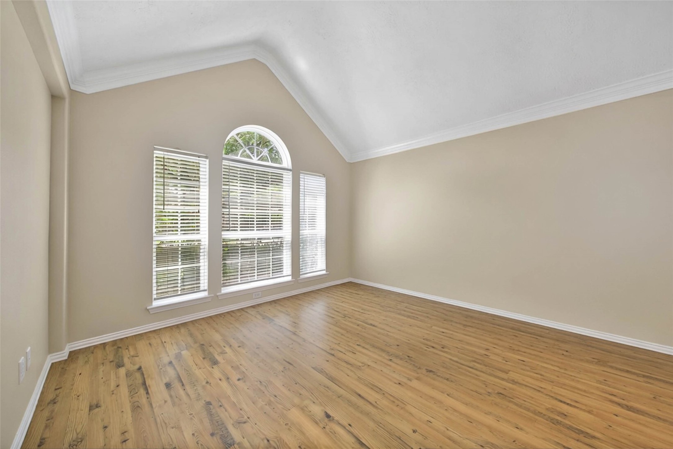 21338 Timber Pines Drive Spring, TX 77388 - Photo 6 of 29 a view of an empty room with window and wooden floor
