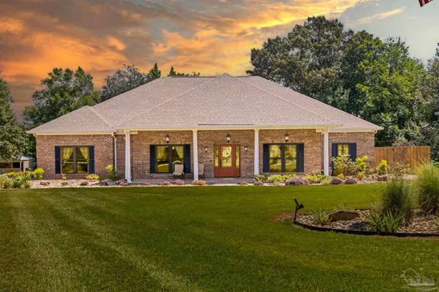 a view of a house with backyard porch and patio