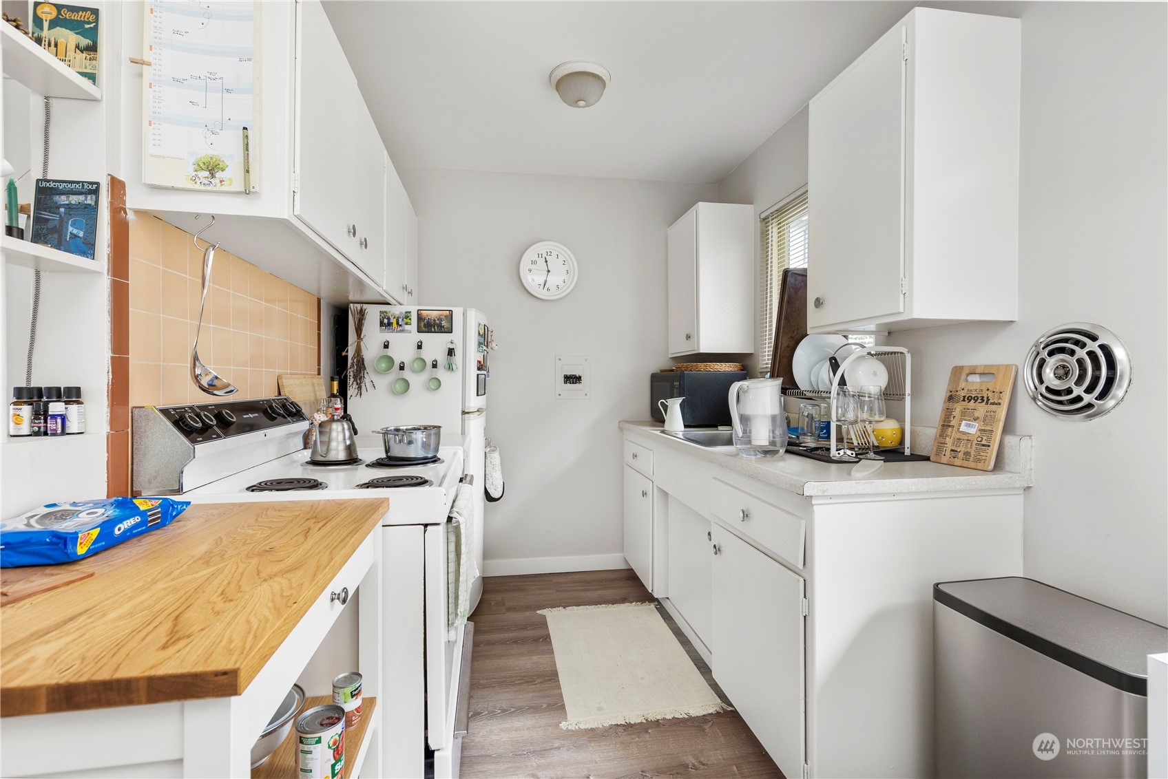 601 East Roy Street Seattle, WA 98102 - Photo 23 of 26 a kitchen with a sink stove and refrigerator
