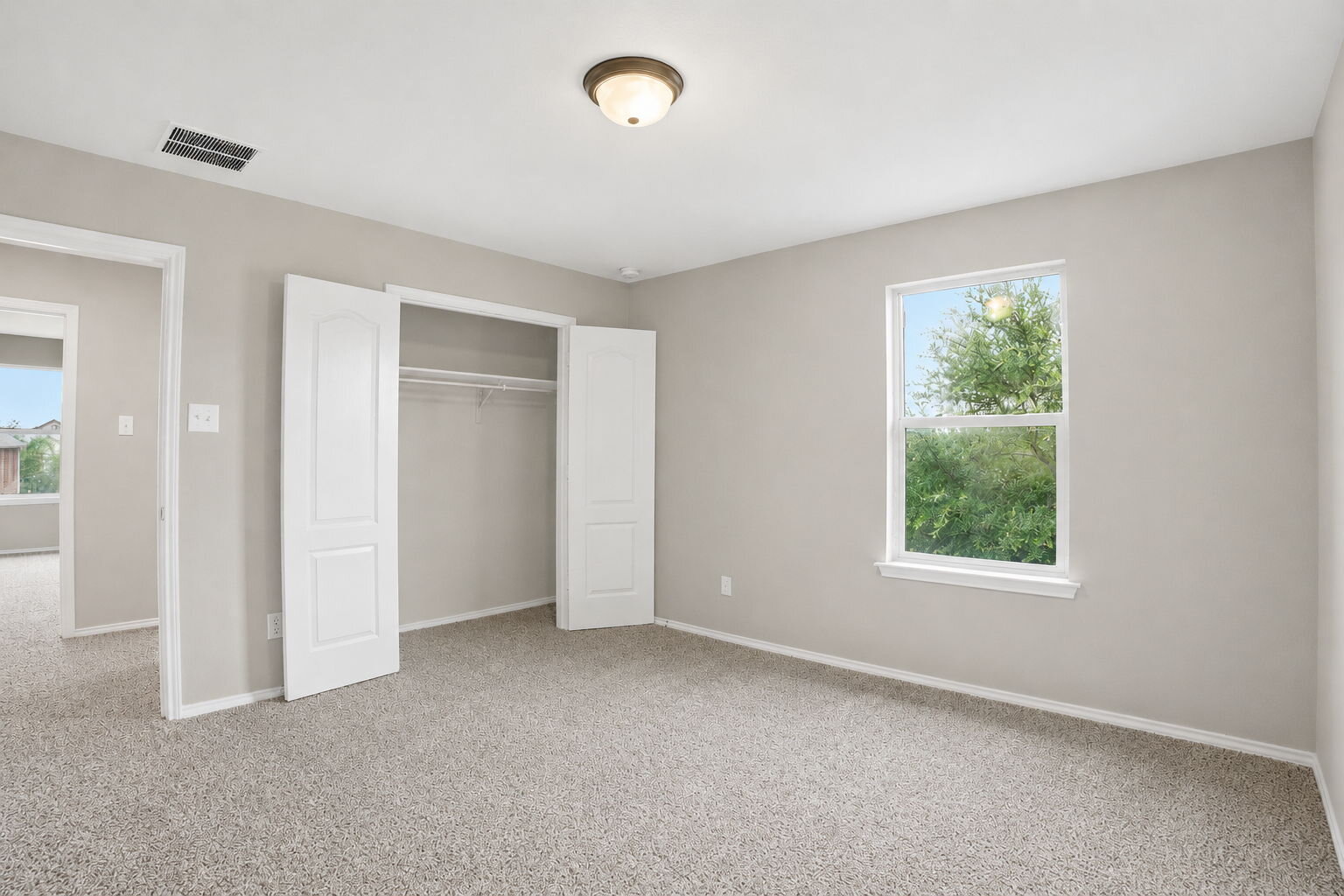 670 Landon Samuel Loop Pflugerville, TX 78660 - Photo 8 of 22 Carpeted room featuring a double-door closet, single window, and a flush mount ceiling light